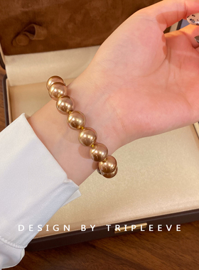 月光彩虹浓茶金！绿紫伴彩南洋金珠仿海水珍珠手链棉线打结手环