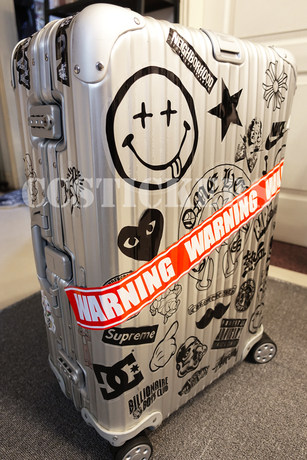 rimowa luggage with stickers