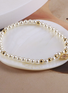 欧美饰品批发闪耀恶魔之眼金色珠珠珍珠拼色眼睛弹力手链代发混批