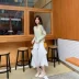 Váy ngủ thỏ nữ 2019 mới xù váy bất đối xứng học sinh Sen bánh váy trắng một chữ - Váy