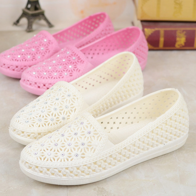 white plastic sandals