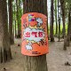 Boxing training target with ring tag tied to tree stump