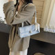 High-end textured small bag for women 2026 new fashion French armpit bag popular baguette single shoulder portable small square bag