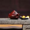 Hand-carved teapot made of rosewood