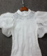 ເສື້ອຢືດ crocheted temperament ເປັນຮູຂຸມຂົນ