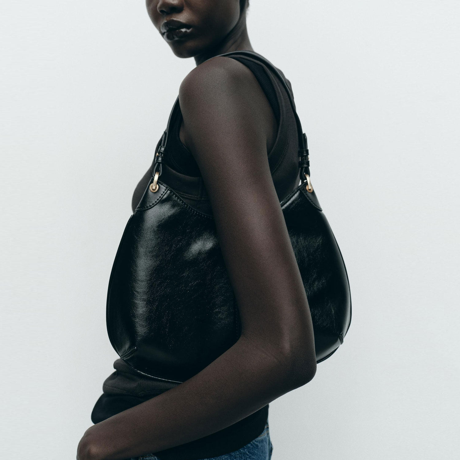 ZA2026春季新品女包百搭通勤黑色椭圆形金属镶饰腋下单肩包托特包