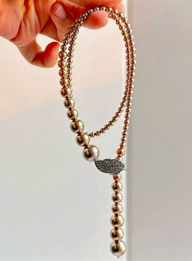 不规则棕色珍珠挂脖项链羽毛扣