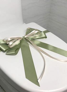 样板房间卫生间马桶装饰蝴蝶结拉花卫浴展厅新房交付绑花封条摆件