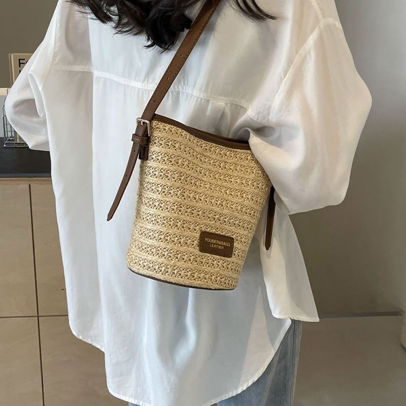 夏天编织草编包包女2025新款海边度假沙滩包百搭小众斜挎包水桶包,淘宝优惠券,粉丝福利购,淘宝优惠卷