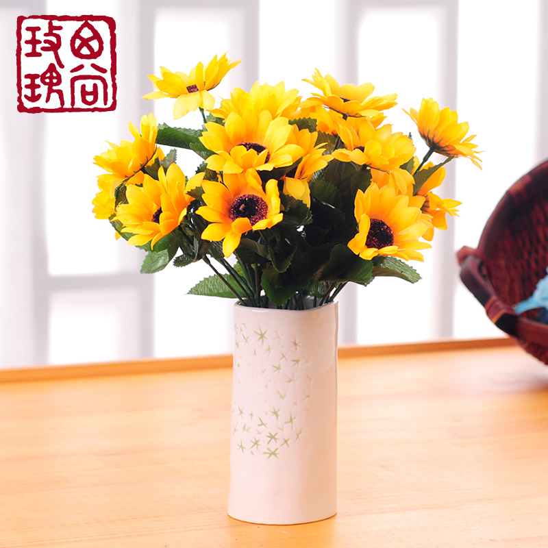 artificial sunflowers in vase