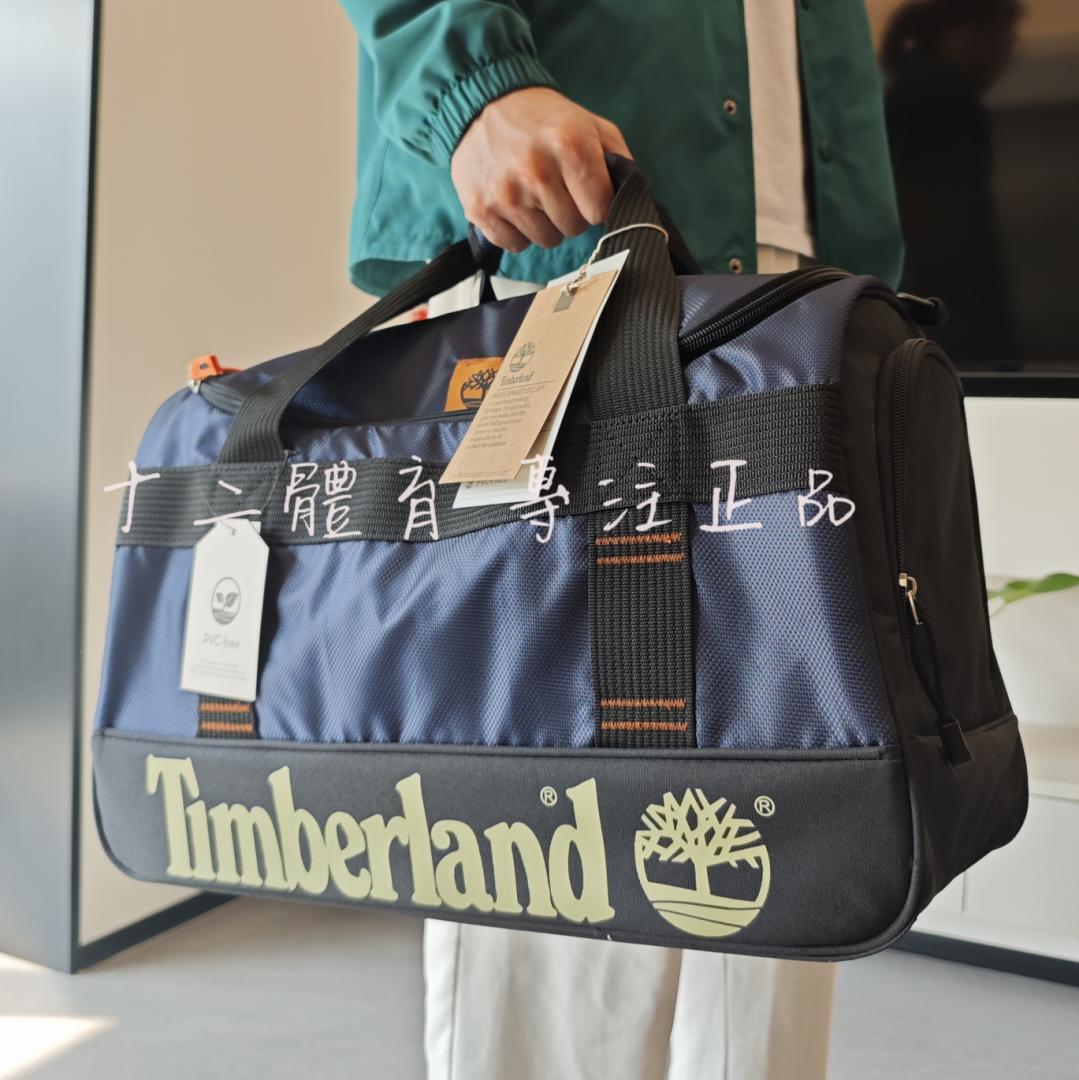 TIMBERLAND/添柏岚男女款大容量手提拎包旅行包运动健身收纳桶包-图0