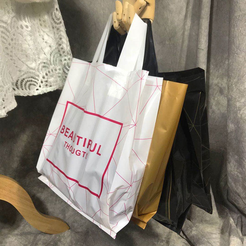男装服装店手挽塑料袋女装衣服袋好看黑色购物手提袋鞋店白色