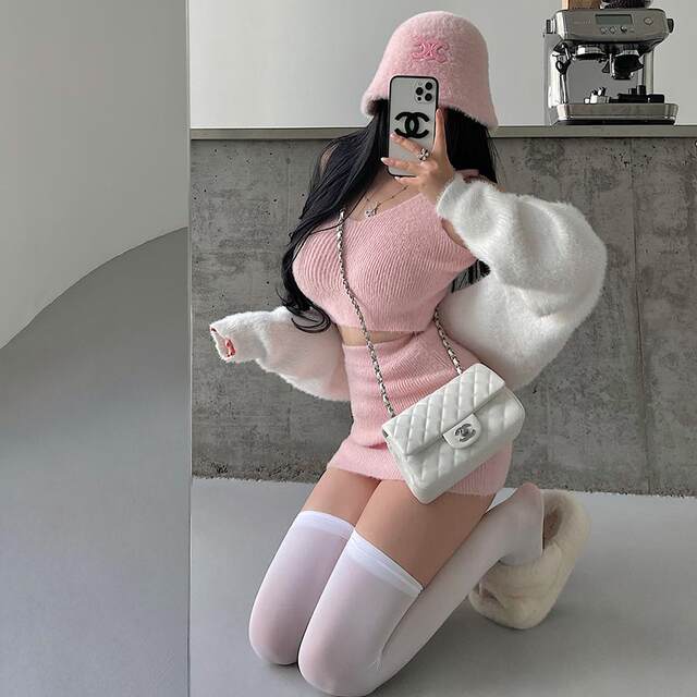 Camisole + cardigan + hip-covering short skirt knitted suit