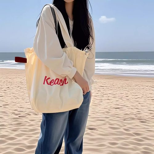 韩版新款字母印花包包女大容量尼龙单肩包休闲百搭便携抽绳托特包 - 图3