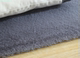 Modern minimalist living room cat-like sofa coffee table blanket