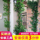 Simulated tree bark covers sewer pipes to cover decorative columns