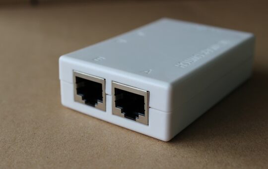 Rj45 two-port network switch sharing device inside and outside