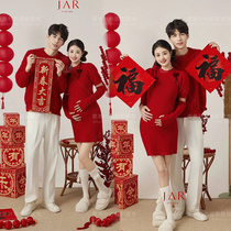 Photothemed pregnant woman photos of New Years lovers suit indoor festive red dragon year themed surrogacy Mimi Art Photography