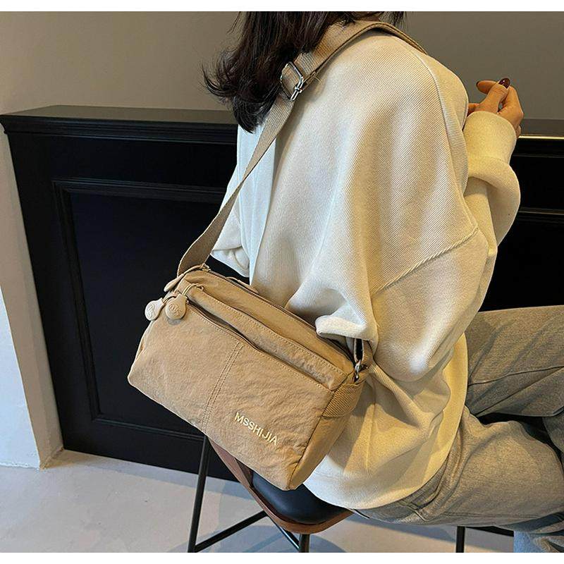 男女同款多层2025新款潮时尚百搭单肩包洋气百搭轻便斜挎布包,淘宝优惠券,粉丝福利购,淘宝优惠卷