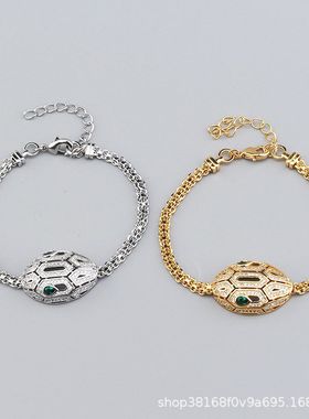 HTZS跨境时尚镂空蛇头耳环女2025新款镶嵌满钻绿眼蛇形夸张耳钉