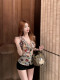 ເສື້ອຍືດຄໍ V-necked premium ruffled sleeveless top