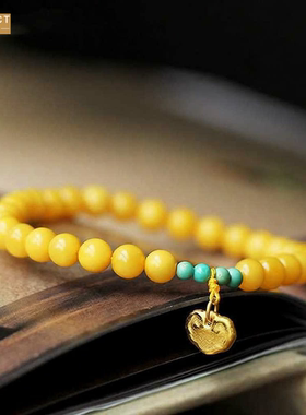 XKDDCT鸡油蜜蜡手链招时吊牌桃花