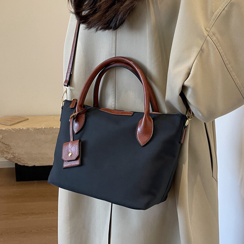 大容量上班通勤托特包包女士2025新款休闲斜挎大包手提牛津帆布包,淘宝优惠券,粉丝福利购,淘宝优惠卷