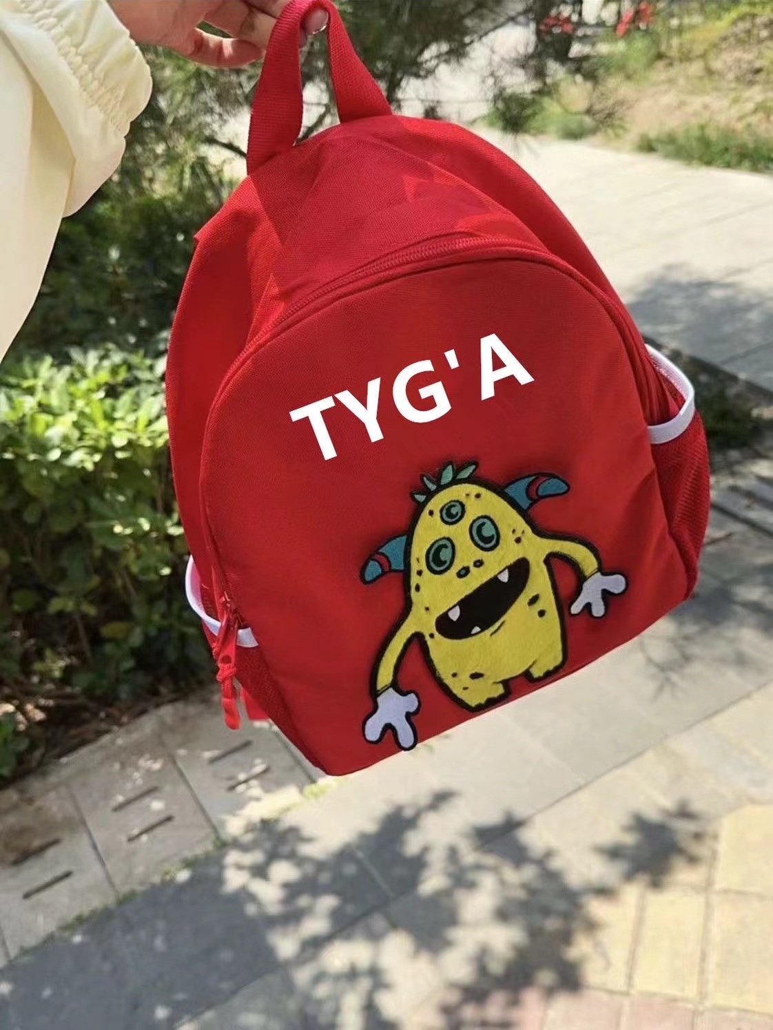 TYGA 超级红卡通小怪兽书包学生韩版可爱小背包初中高中生双肩包
