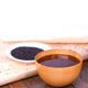 Taiwanese style Beigang three-cup chicken confinement meal with black sesame oil