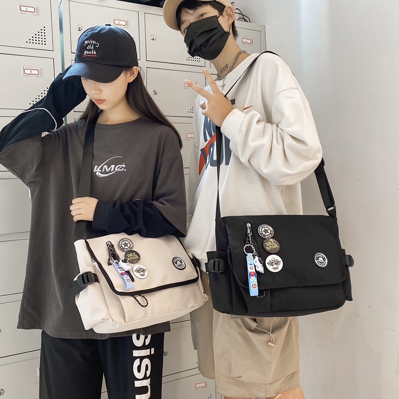 机能男休闲潮牌学生大容量女斜挎包 尼麦男士包袋