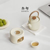 Thirty-year-old small porcelain teapot with raised beams
