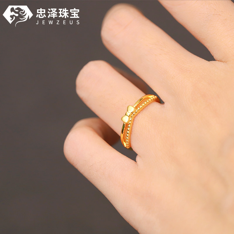 Small weight bow gold ring stacking ring