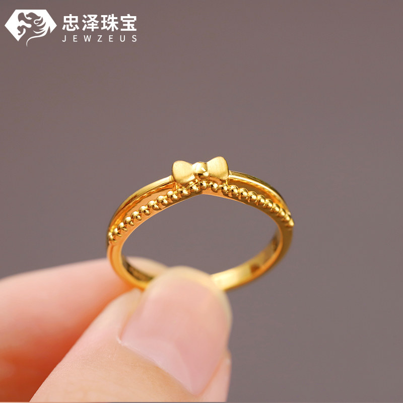 Small weight bow gold ring stacking ring