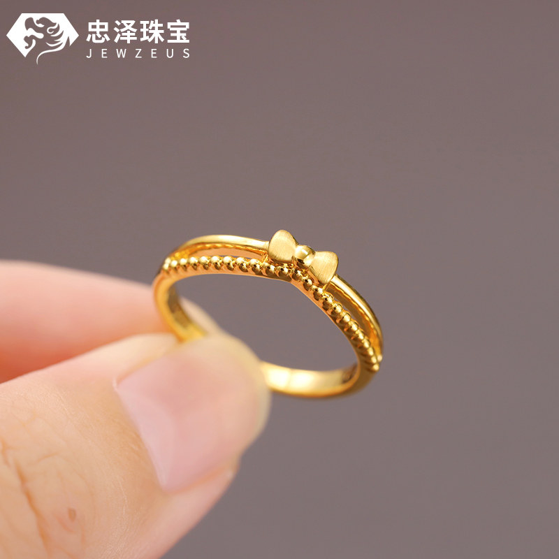 Small weight bow gold ring stacking ring