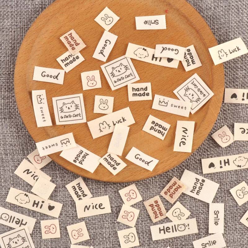 米色标签衣服服装领标手工制作折边布标DIY布贴服饰标签100个,淘宝优惠券,粉丝福利购,淘宝优惠卷