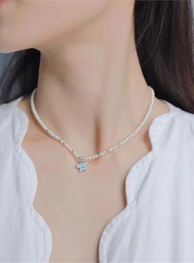 何家小花牌初雪告白K金星光扭结珍珠项链百搭925纯银锁骨链