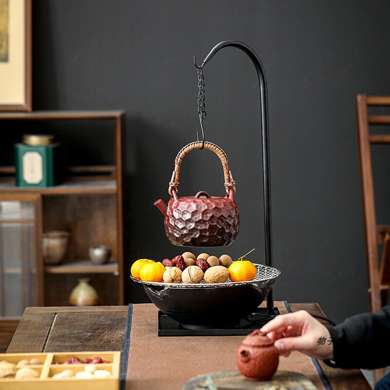 Ceramic teapot for making tea around the stove