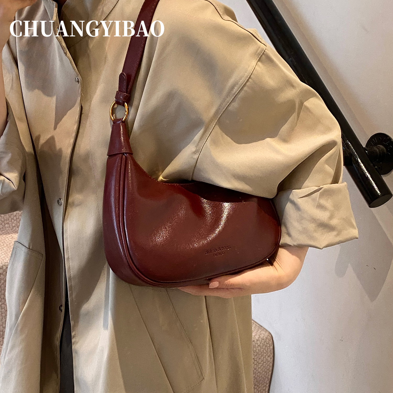 红色超火腋下包包女式2025新款秋冬轻奢小众高级感通勤斜挎饺子包 - 图1