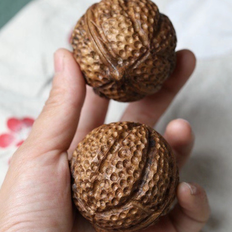 见沁巴布亚沉香核桃手把件把玩老料 见沁摆件