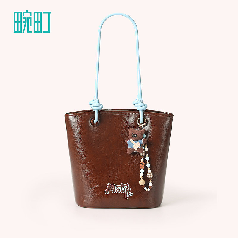 畹町焦糖可露丽油蜡皮包女秋冬复古蓝棕单双肩通勤女包抽绳水桶包,淘宝优惠券,粉丝福利购,淘宝优惠卷