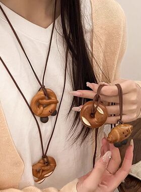 独特小众韩国挂脖毛衣链麂皮绳碱水结仿真树脂牛角包项链树脂女款