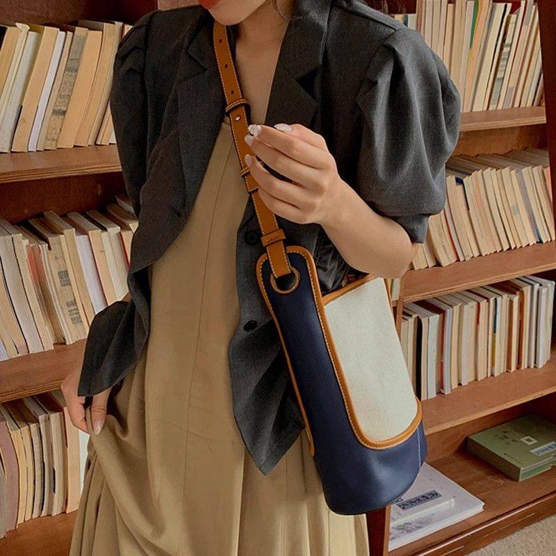 金狐狸包包女包2025新款帆布水桶包大容量小众时尚撞色单肩斜挎包,淘宝优惠券,粉丝福利购,淘宝优惠卷