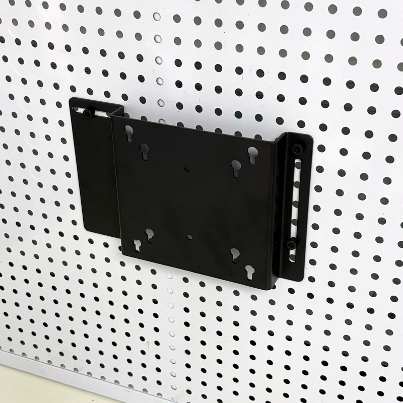 Perforated board computer screen stand saves space