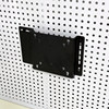 Perforated board computer screen stand saves space