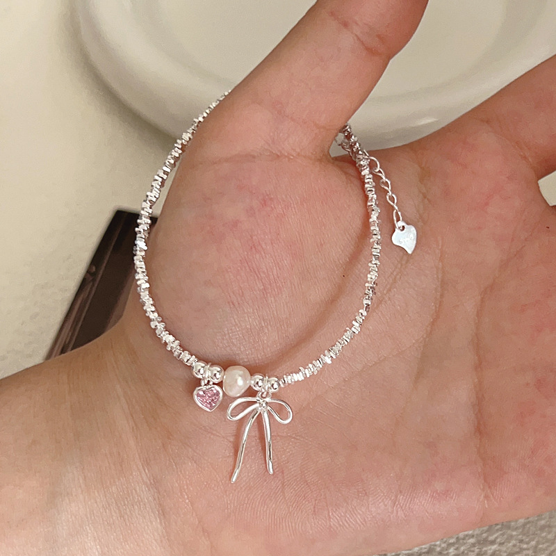 S925纯银甜美少女心粉色爱心蝴蝶结碎银子珍珠手链日韩简约设计款