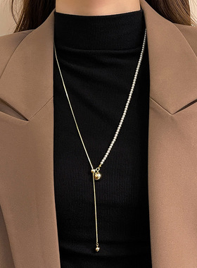 秋冬长款可抽拉调节珍珠圆球毛衣