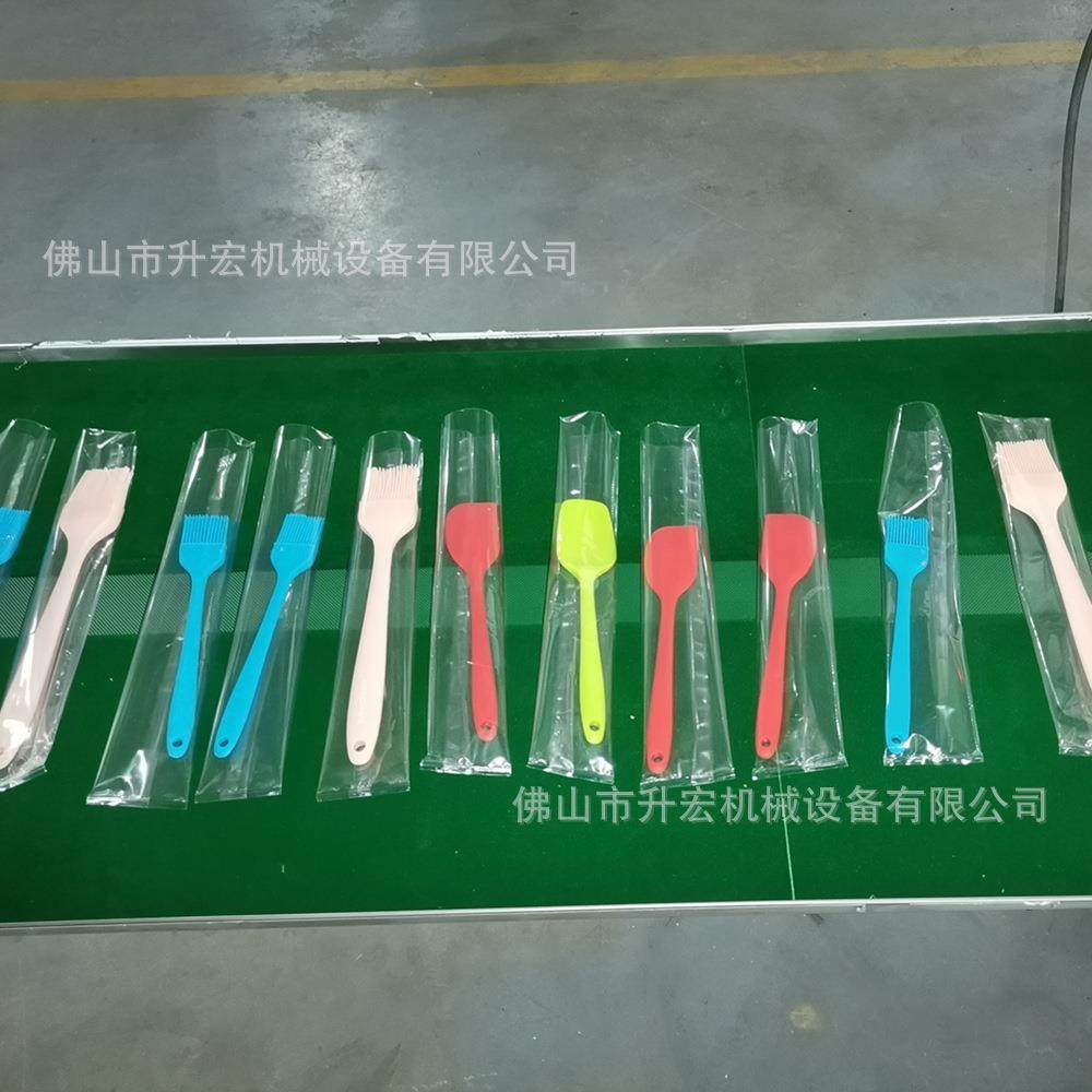 佛山包装机基地厨房勺子包装机漏勺封口机硅胶厨具自动包装机,淘宝优惠券,粉丝福利购,淘宝优惠卷