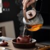 Light luxury walnut electric ceramic stove, heat-resistant glass lifting beam kettle, tea making set around the stove