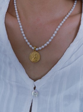 天然珍珠项链游七月钛钢吊坠钛钢