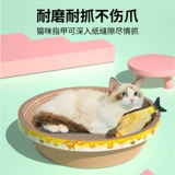 Кошка захватывает миску в форме кошачьего гнезда кошачья кошачья гнезда гнездо гнездо гнездо гнездо.
